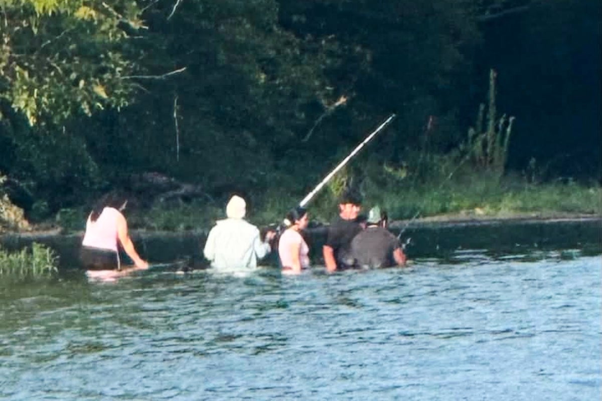 The haunting photo believed to show five victims moments before they drowned